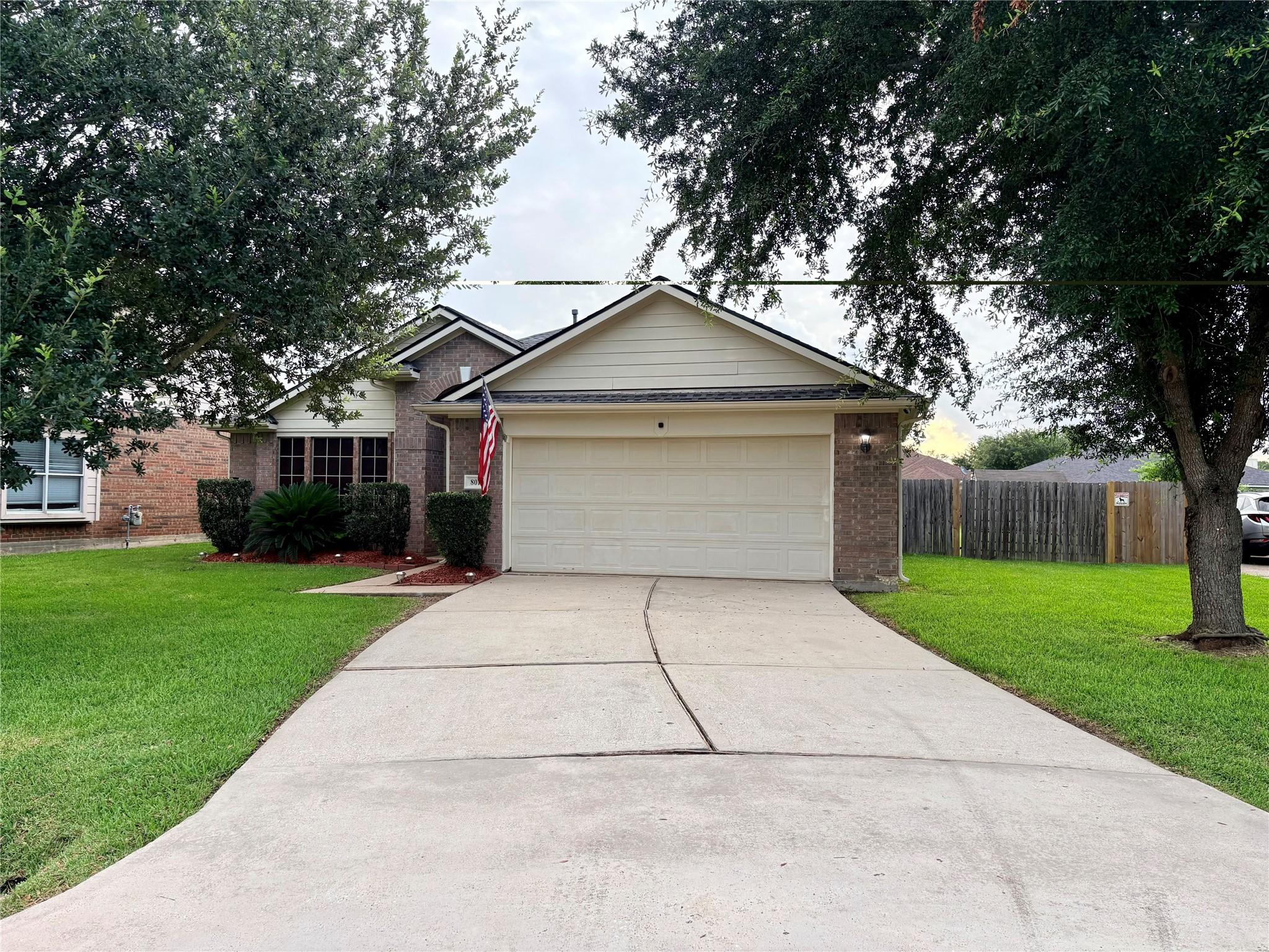 Image 2: Double wide driveway with double gate on the right
