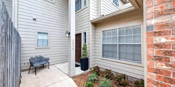 Image 3: Private courtyard entry welcomes you with low-main