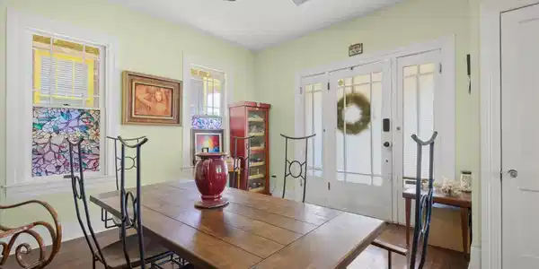 Image 4: This Dining Room features hardwood floors, and two