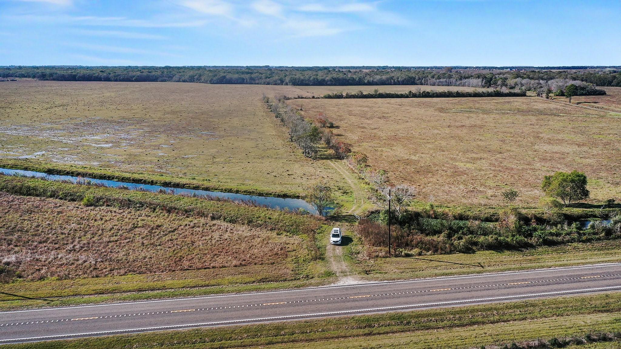 Image 1: Entry by Easement.  Follow the treeline down and t