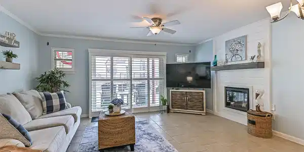 Image 2: Spacious living room with a cozy fireplace for tho