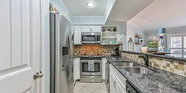 Image 3: Beautiful coastal kitchen complete with wine fridg