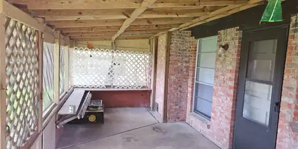 Image 2: Large screened porch provides a shaded retreat for