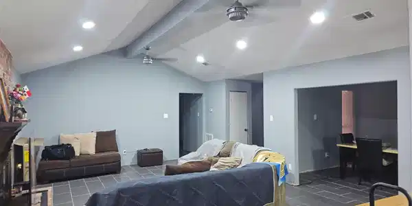 Image 4: Spacious living room features vaulted ceilings, re