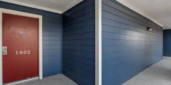 Image 4: Front door entrance.  Solid doors and the paint is