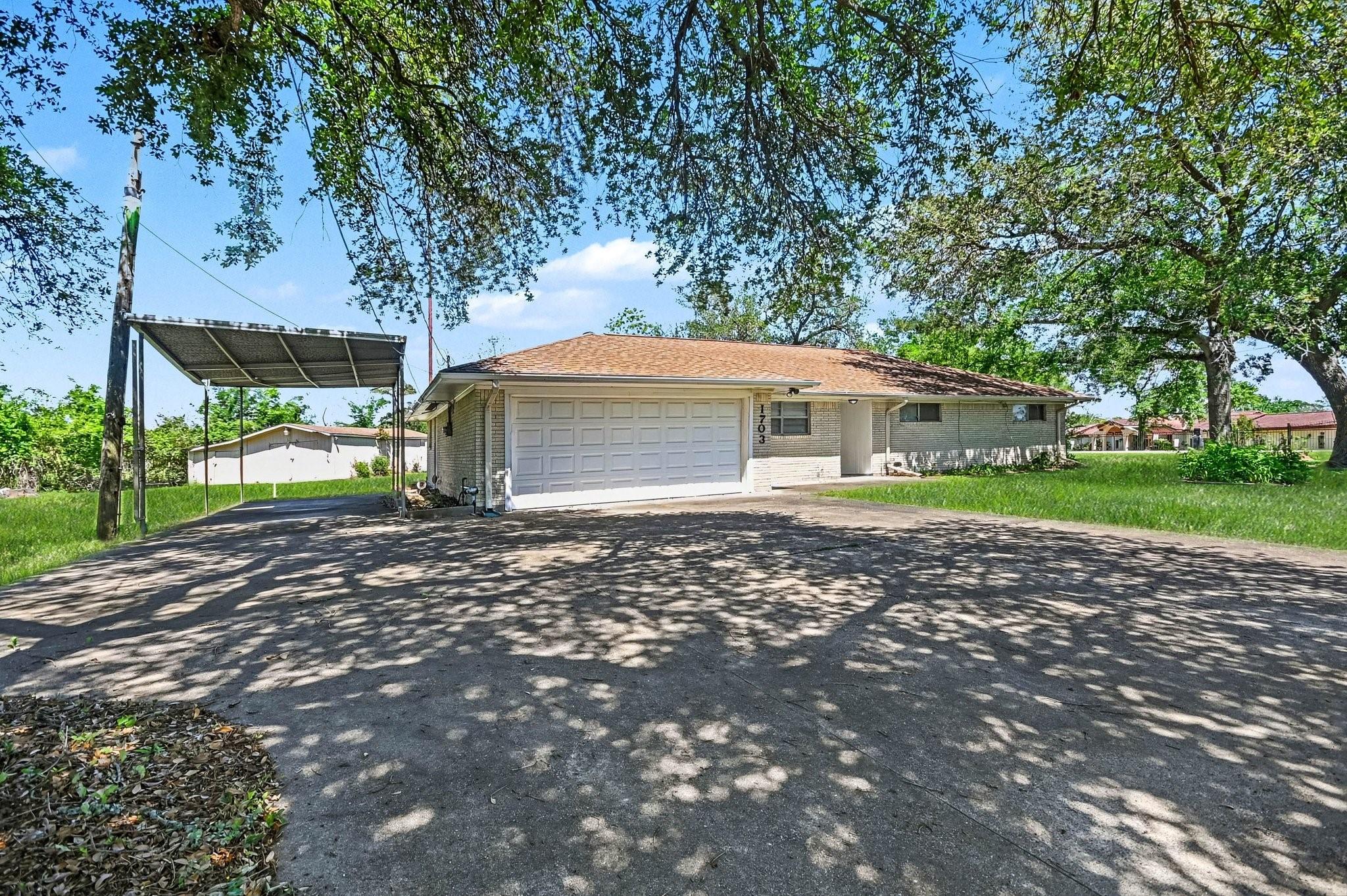 Image 3: This home offers abundant parking for you and your