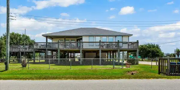 Image 2: Spacious coastal home with a large fenced yard and