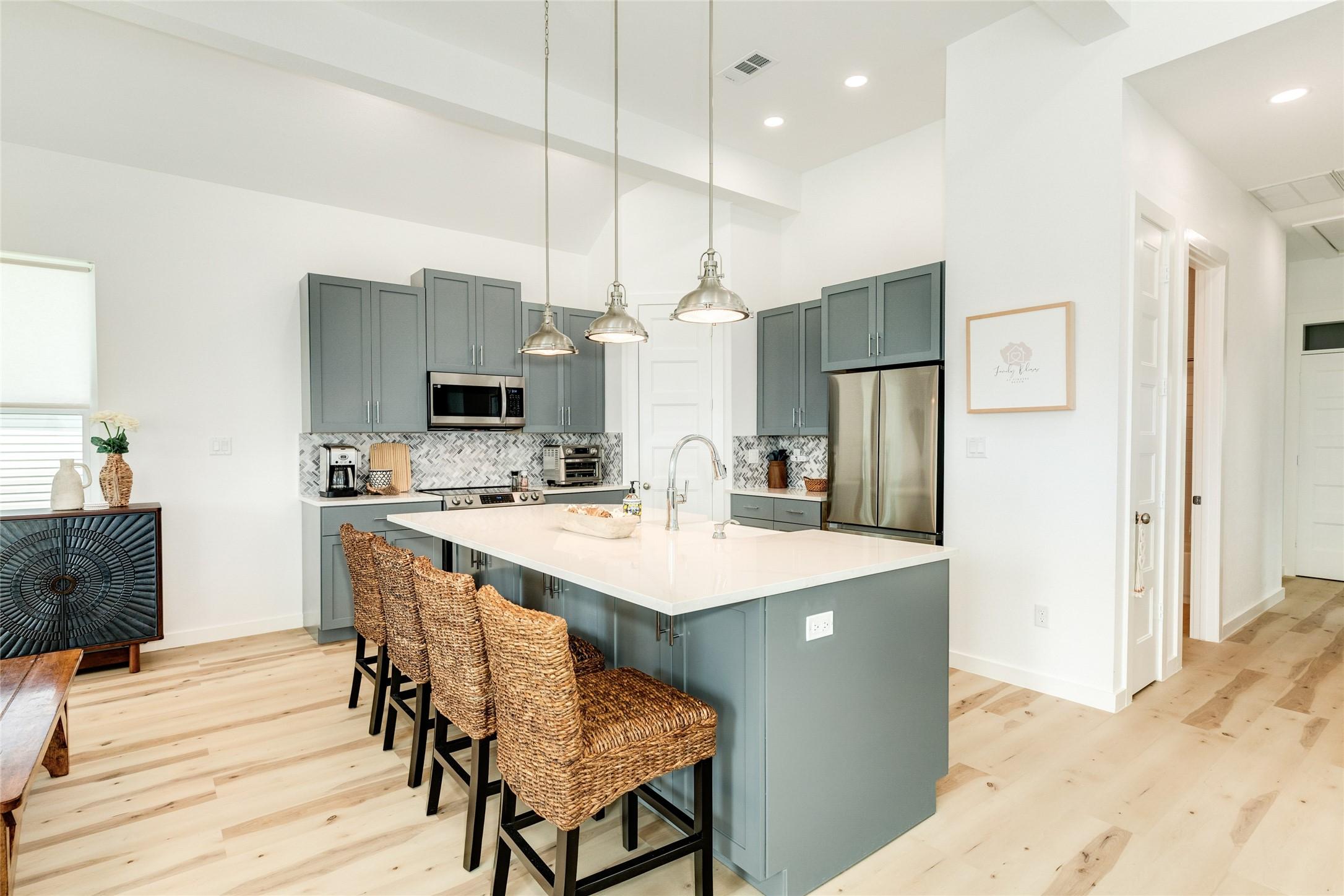 Image 4: Spacious kitchen with a breakfast bar...perfect fo