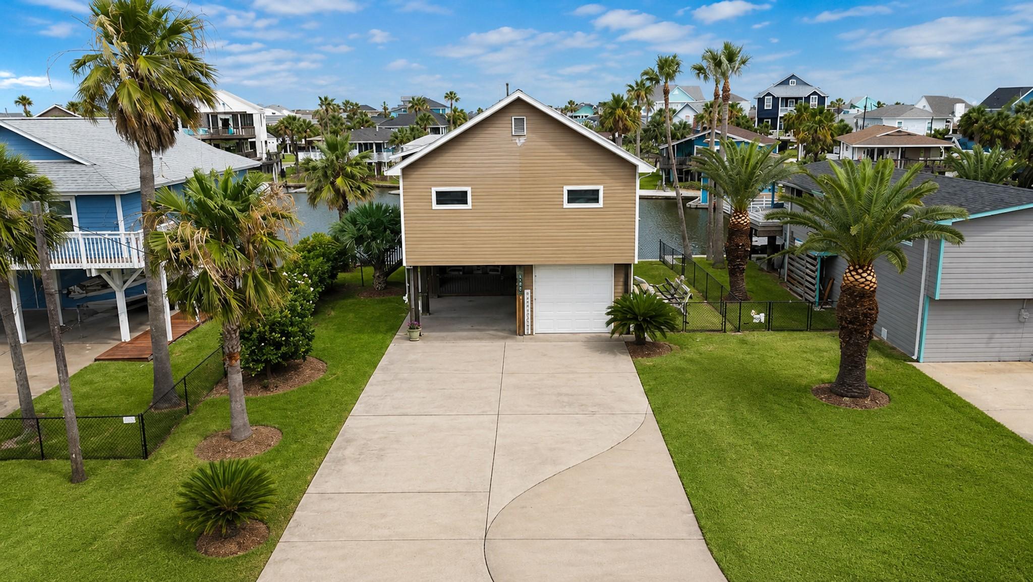 Image 2: Excellent curb appeal with a wide, concrete drivew