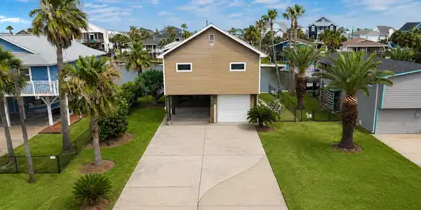 Image 2: Excellent curb appeal with a wide, concrete drivew
