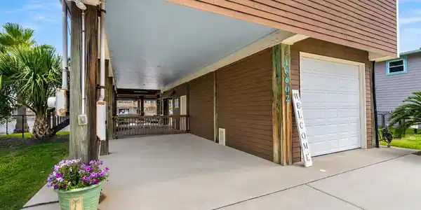Image 3: The expansive covered lower level features an atta