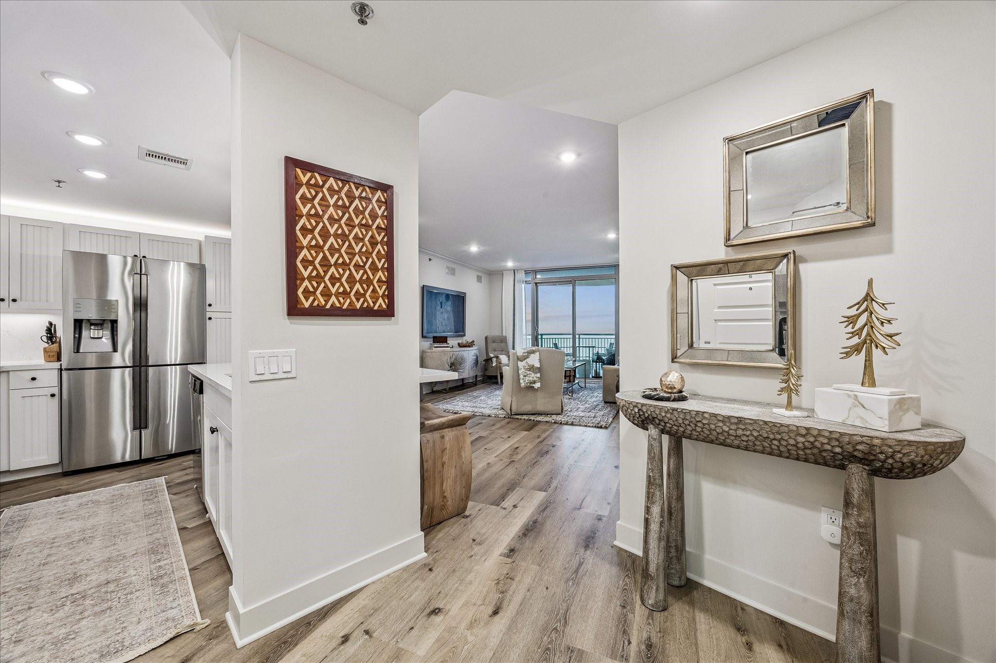 Image 2: Modern entryway with stylish neutral finishes. The