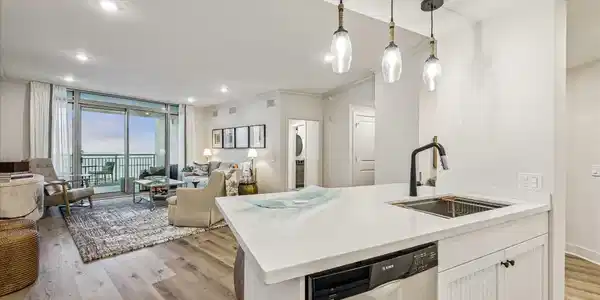 Image 3: This modern open-concept living space features a s