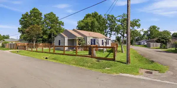 Image 4: Corner lot with expansive fenced yard.