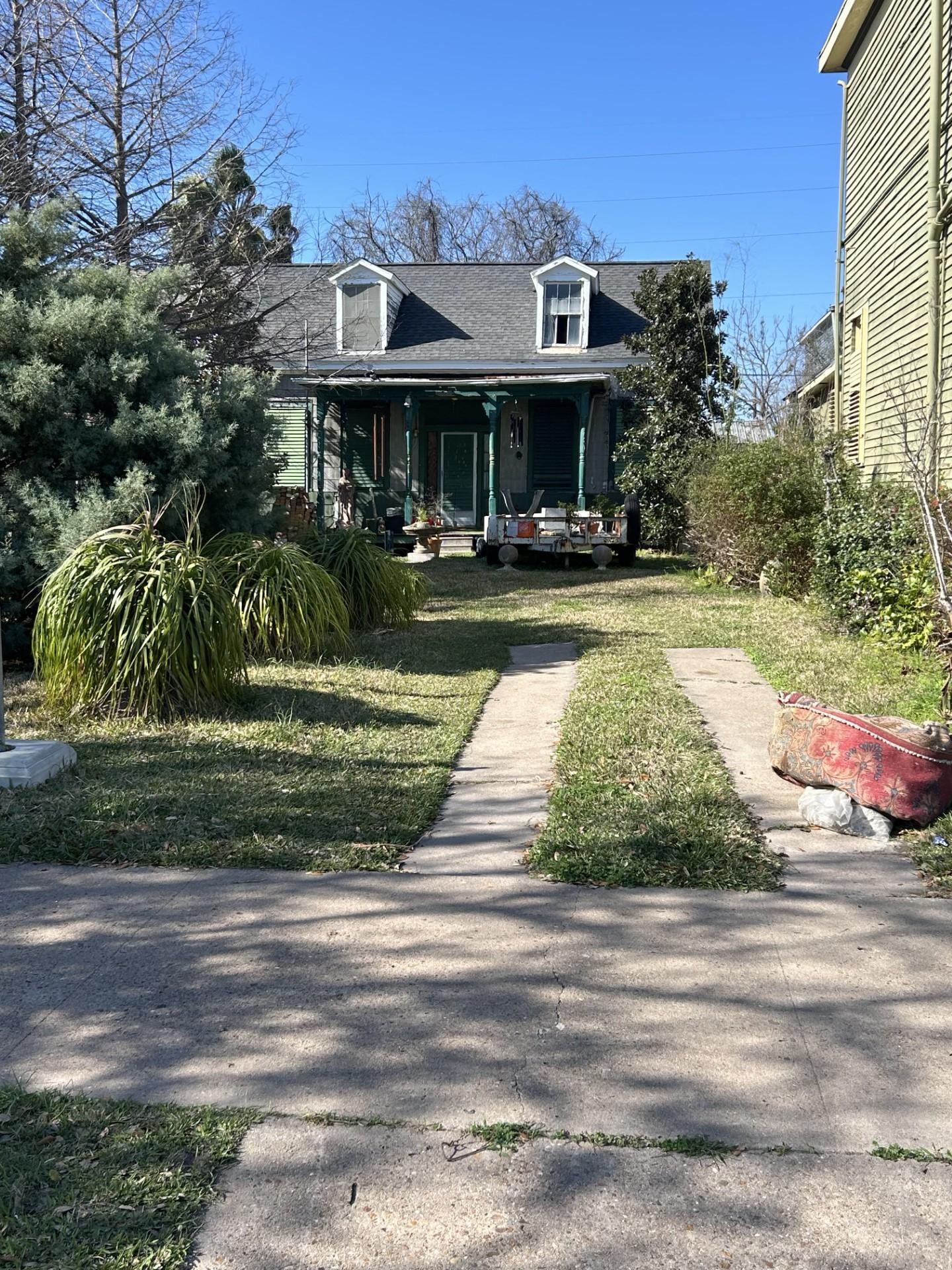Image 2: From the street, a view of the house. It once sat