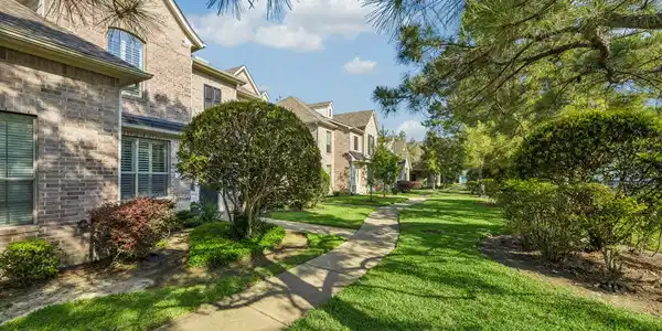 Image 2: Enjoy well manicured green space in front of the t
