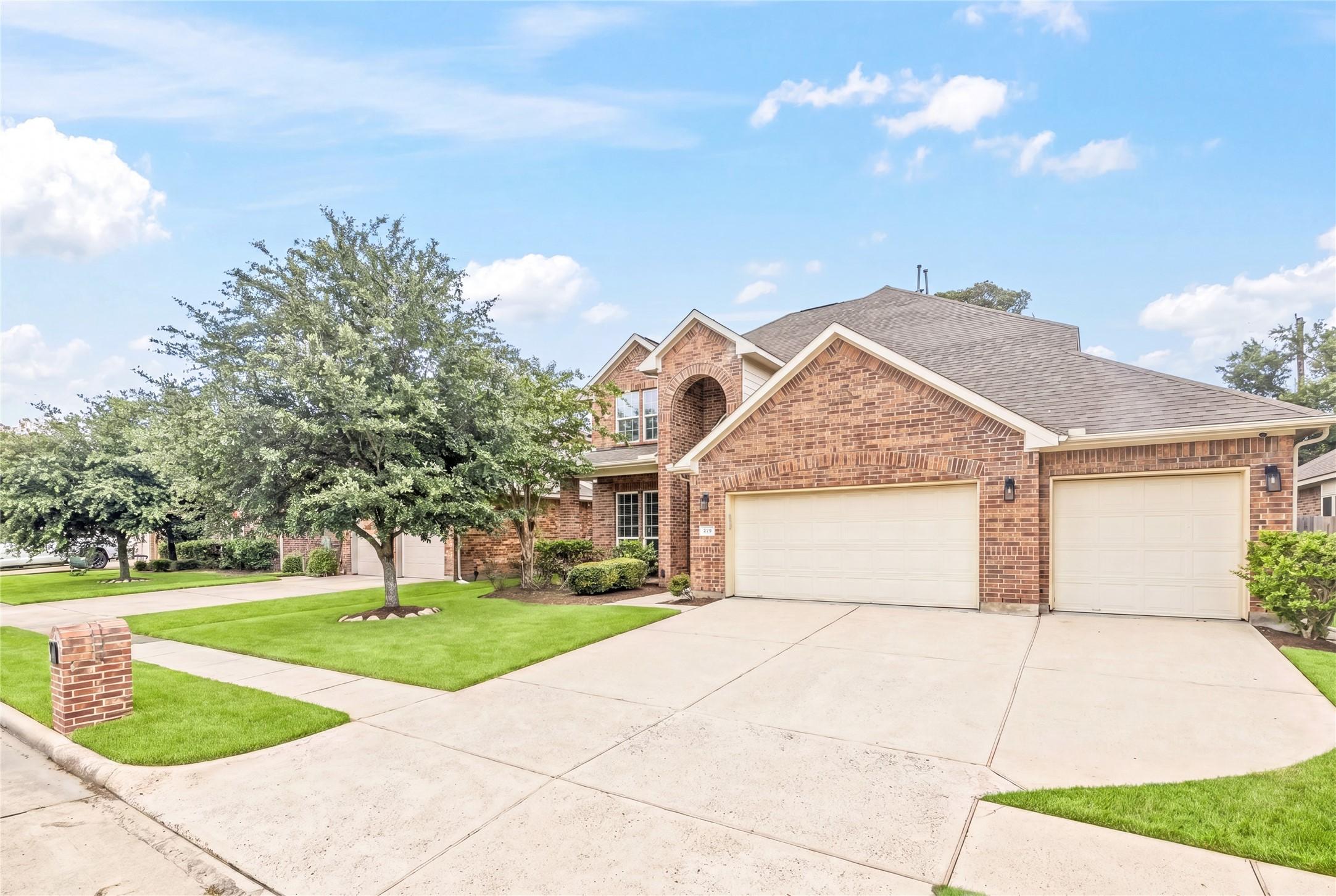 Image 2: Home features a three car garage