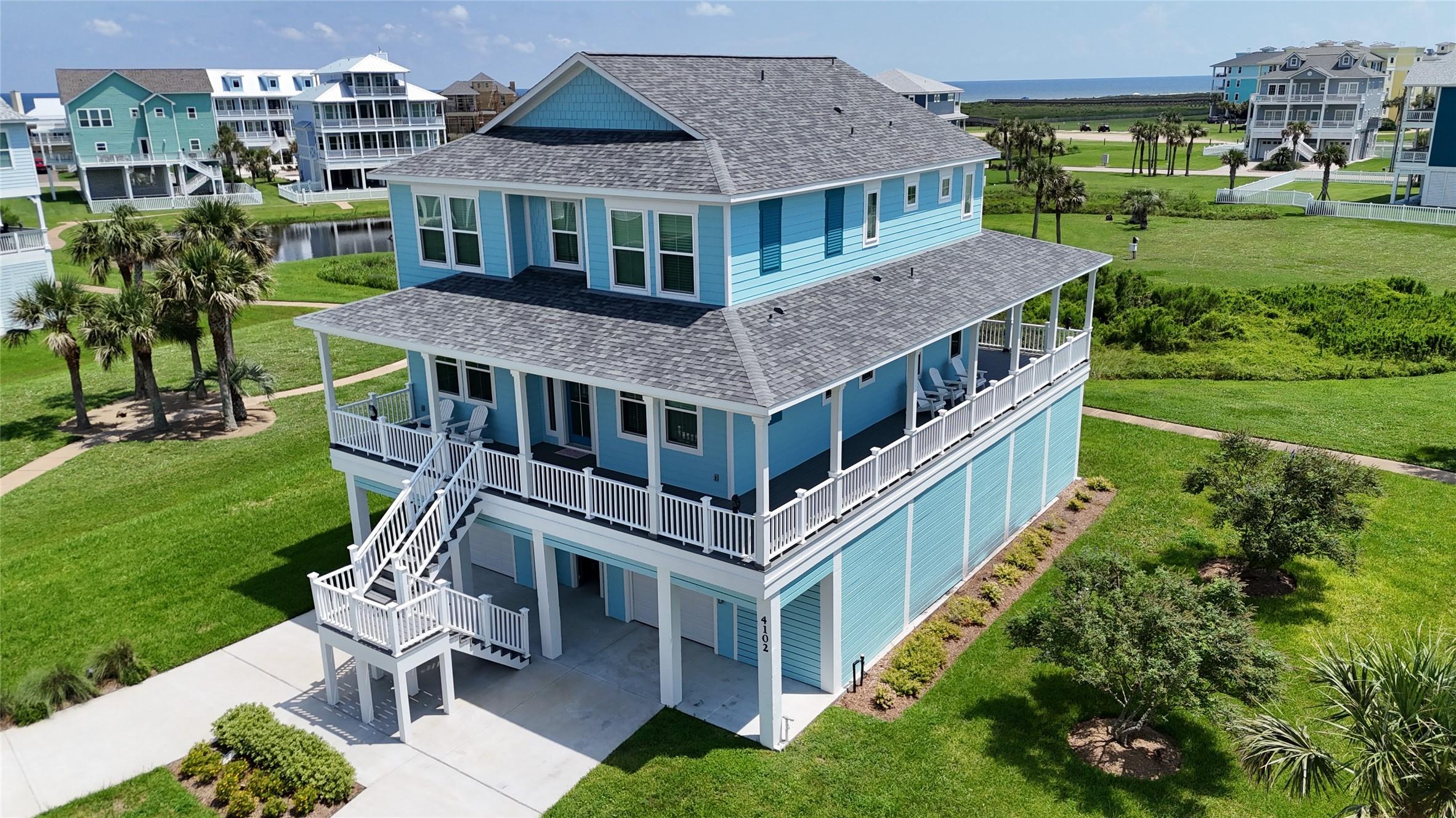 Image 2: Stunning coastal home with wraparound decks, lush
