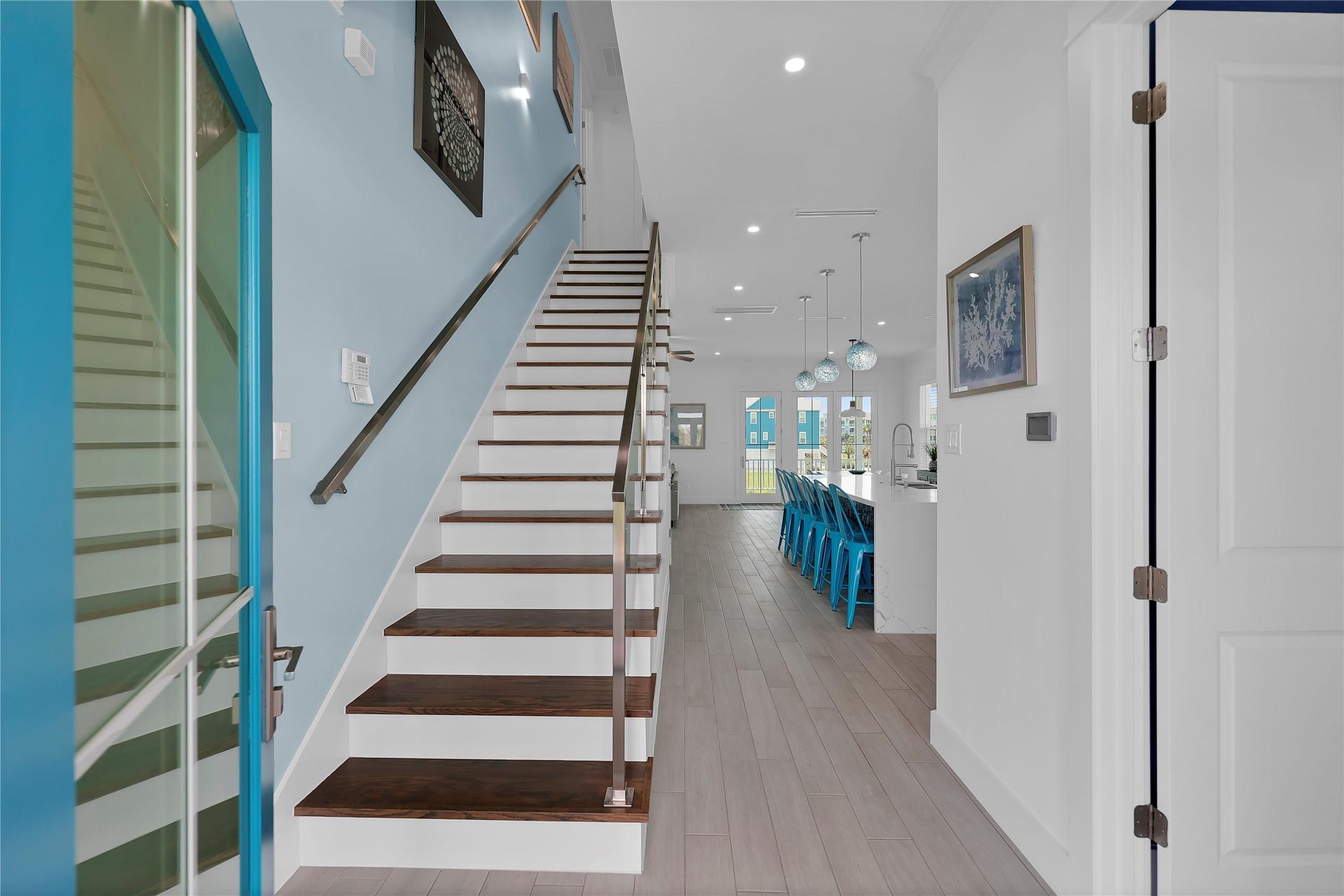 Image 3: A welcoming entry with Spanish porcelain tile floo