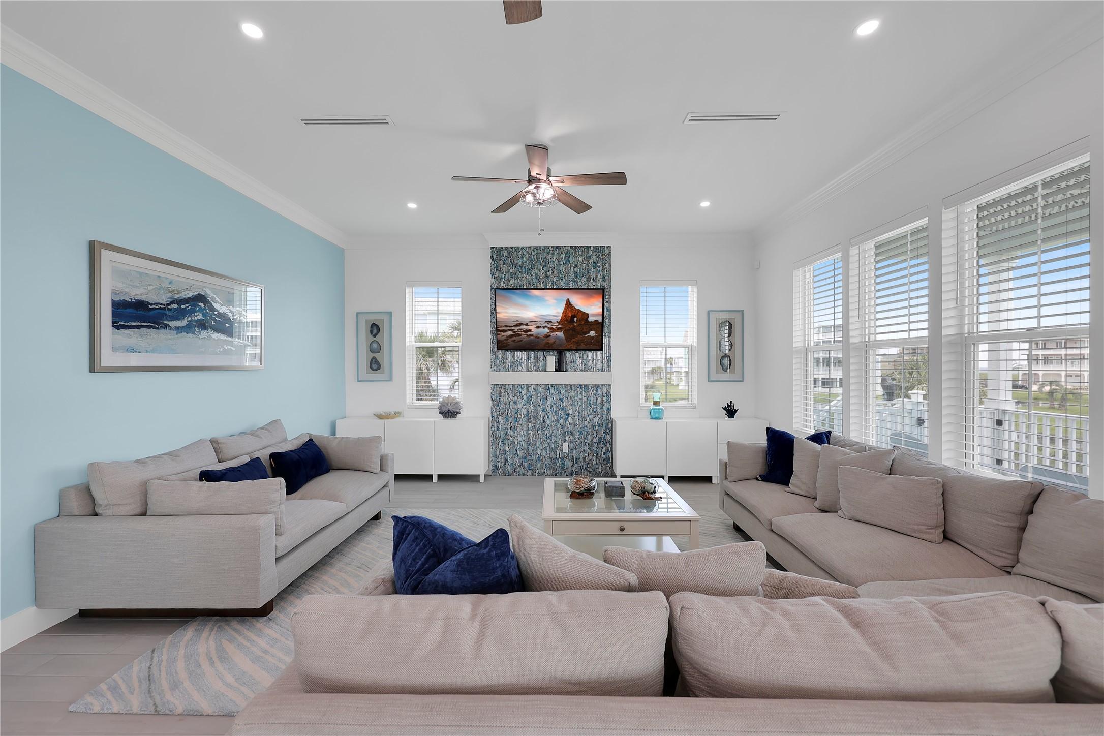 Image 4: Spacious living room filled with natural light, hi