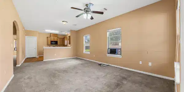 Image 4: The spacious main living area flows into the kitch