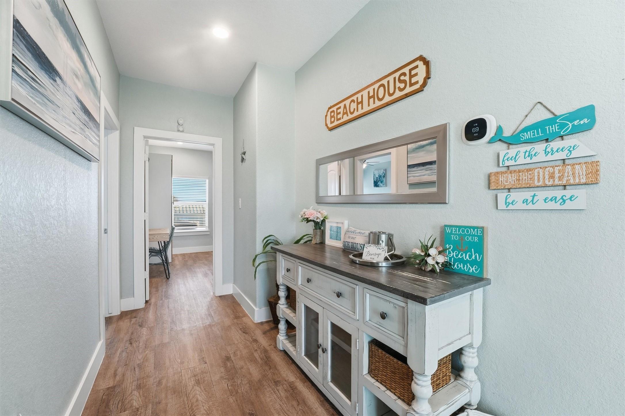 Image 4: Charming interior hallway with custom console, bea