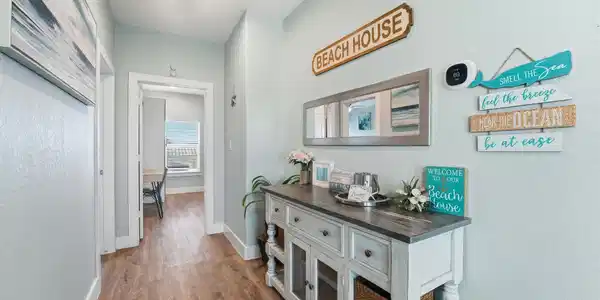 Image 4: Charming interior hallway with custom console, bea
