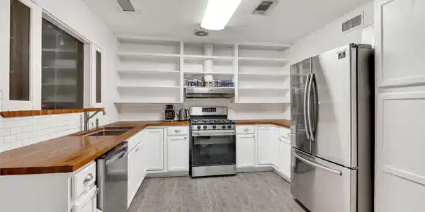 Image 4: Modern kitchen featuring sleek stainless steel app