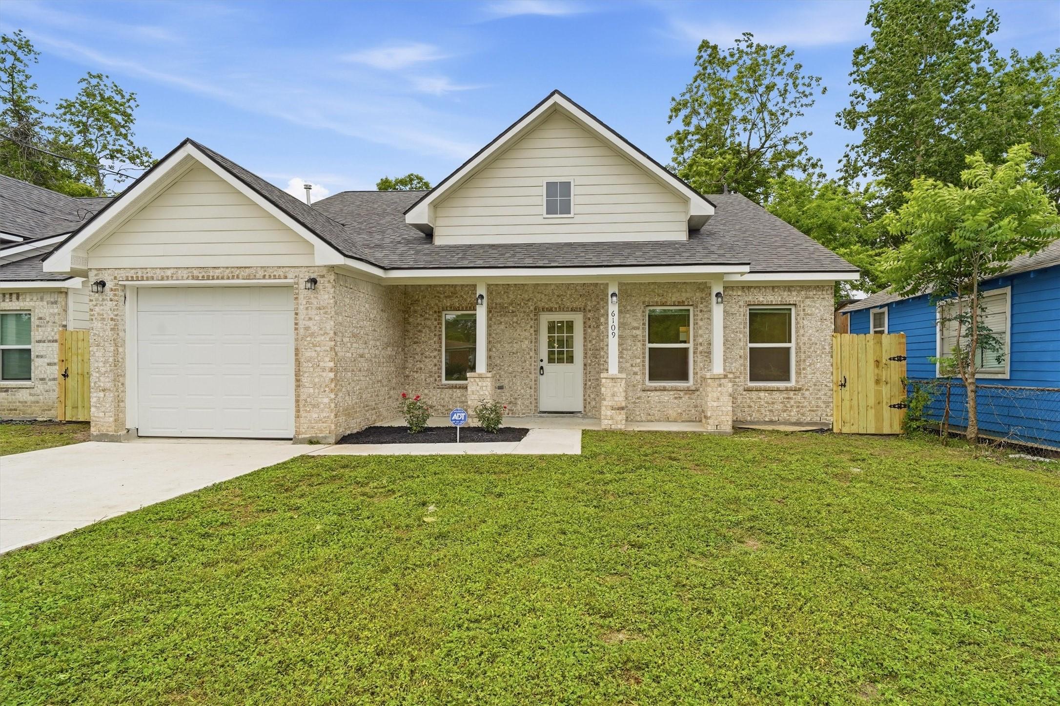 Image 1: Charming 3/2/1 with fresh landscaping located in T