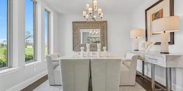 Image 3: Just off the foyer, the formal dining room is bath