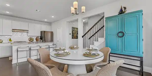 Image 4: The breakfast area is filled with natural light fr