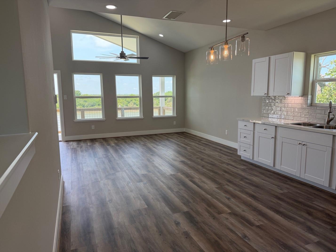 Image 3: Living room has abundant natural lighting   and op