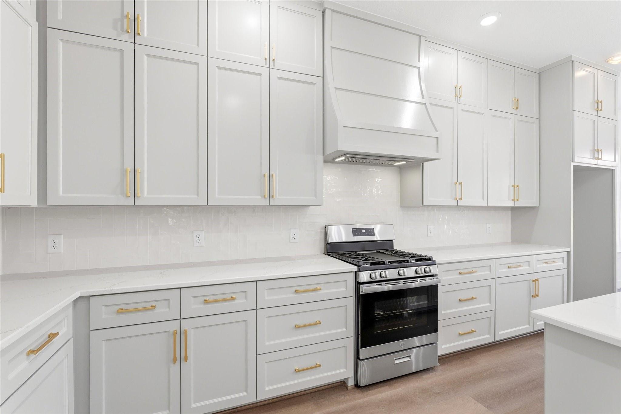 Image 2: The kitchen offers exceptional storage with floor-
