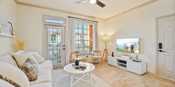 Image 2: Large windows that flood the living room with natu