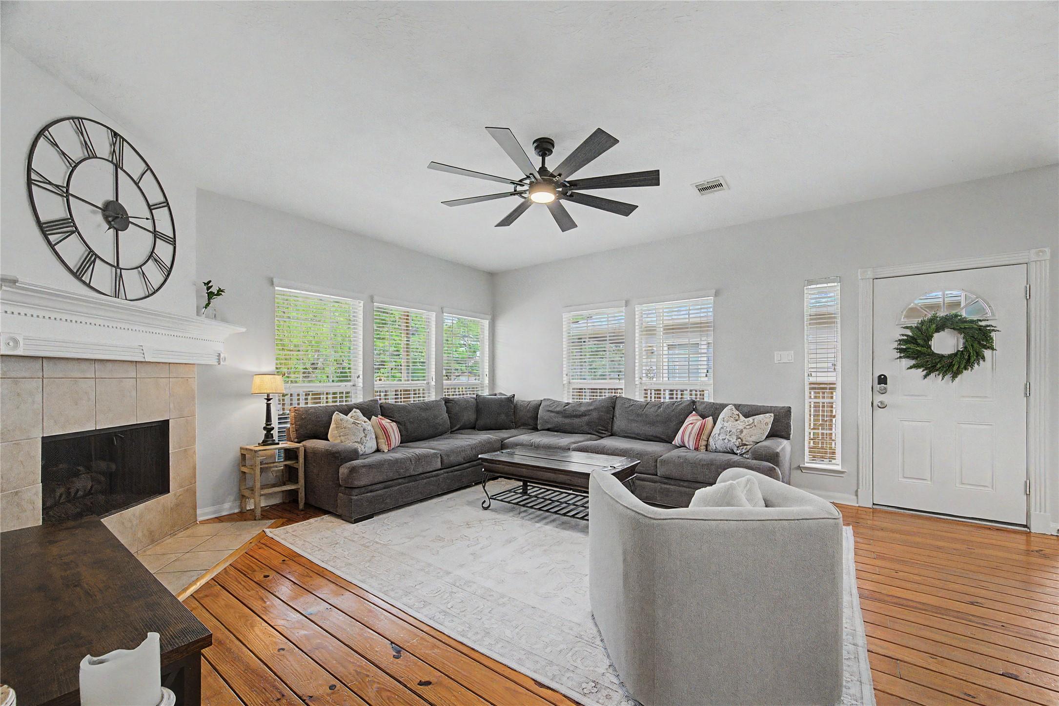Image 1: This inviting living room features a spacious layo