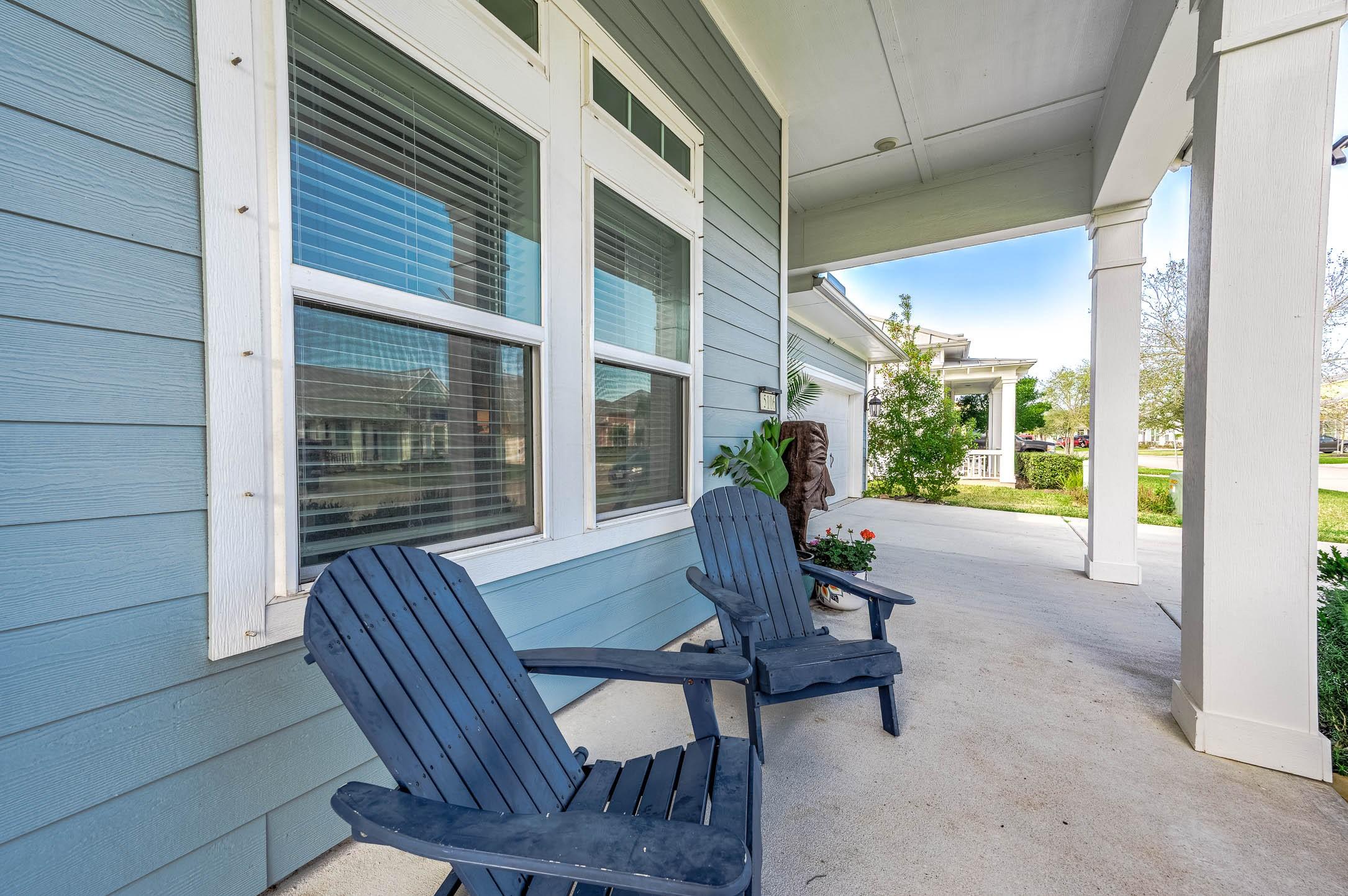 Image 4: The covered front porch  is perfect for relaxing.