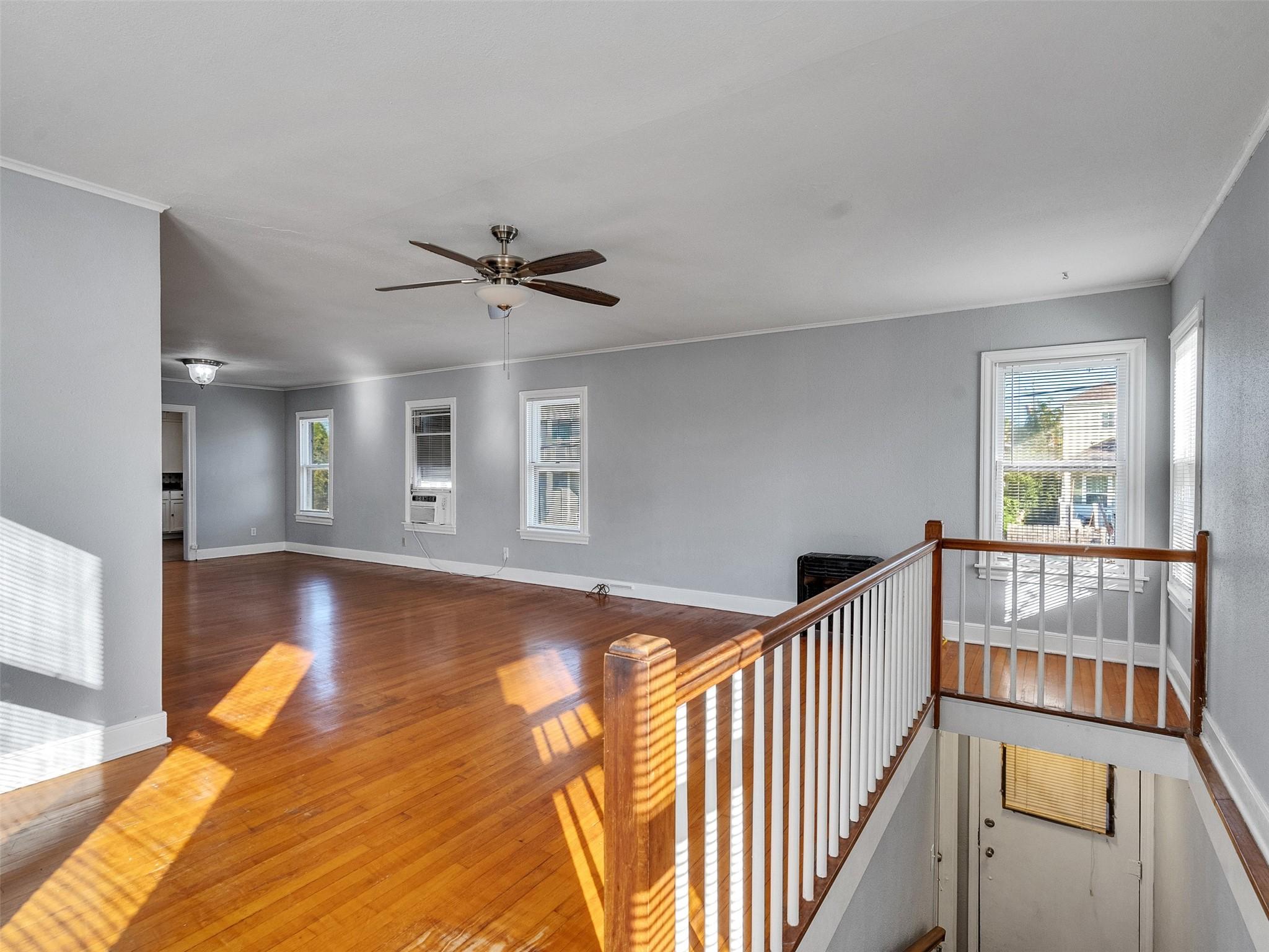 Image 4: From upstairs, soak in the open layout of the livi