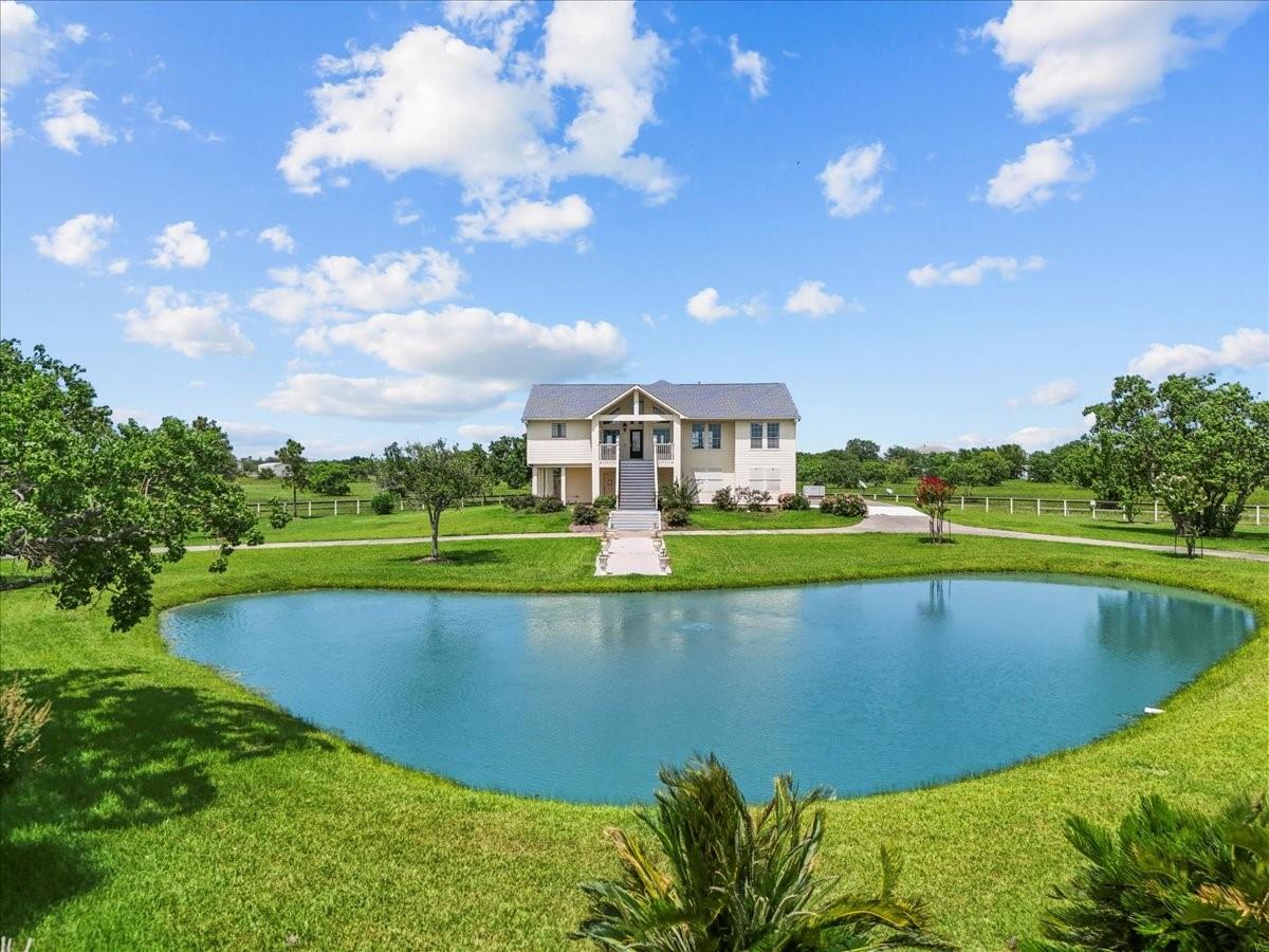 Image 1: This photo showcases a charming two-story home set