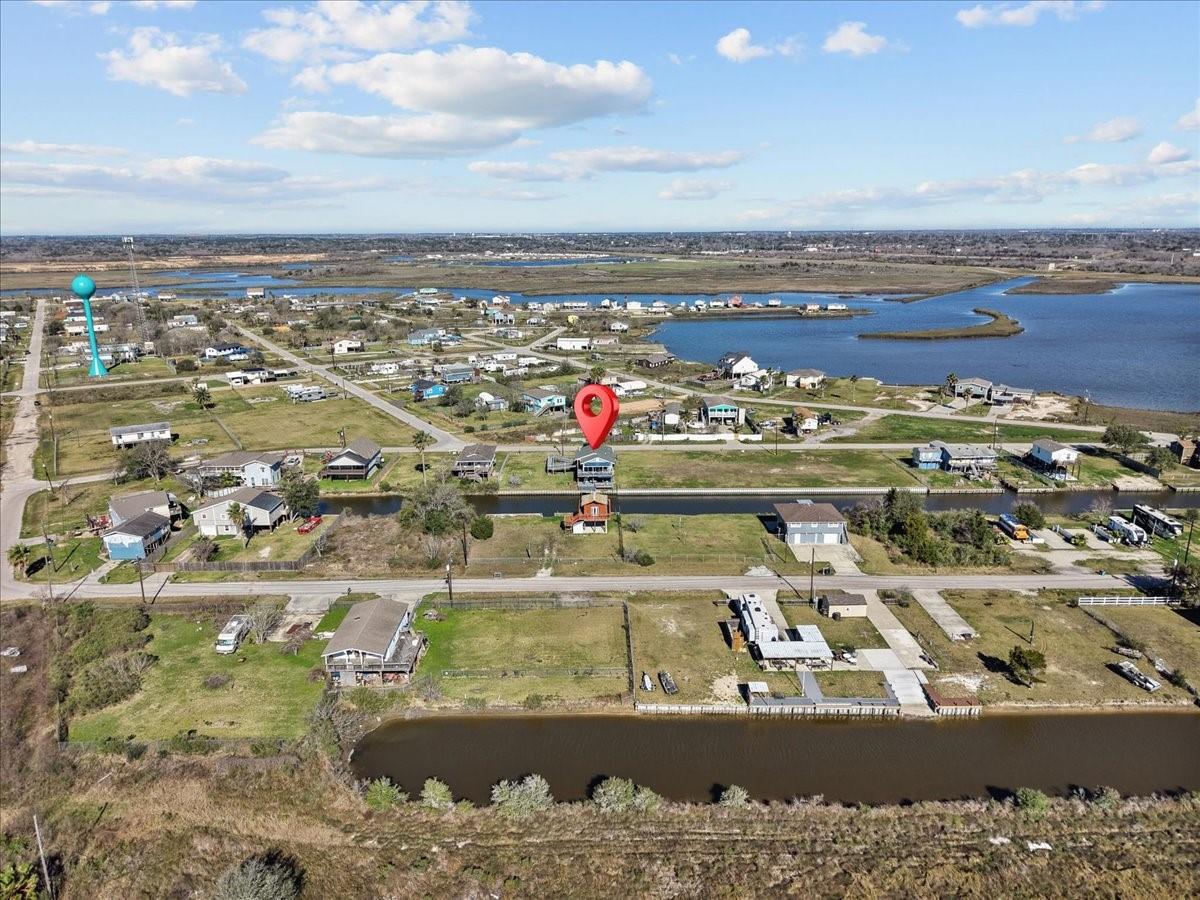 Image 1: This aerial photo showcases a spacious residential
