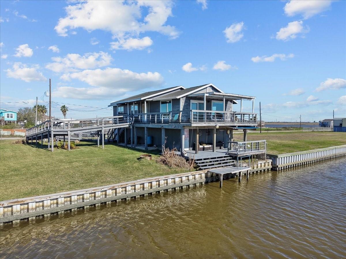 Image 2: The property features ample outdoor space and dire