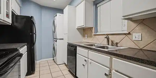 Image 3: Stacked washer/Dryer, tile floor