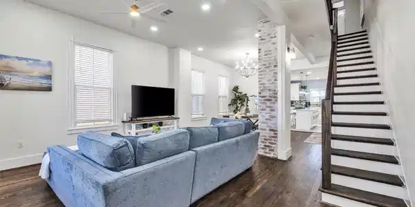 Image 3: View from front door shows open concept with livin