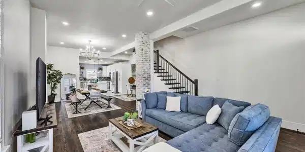 Image 4: Open concept with living room, dining room, and ki