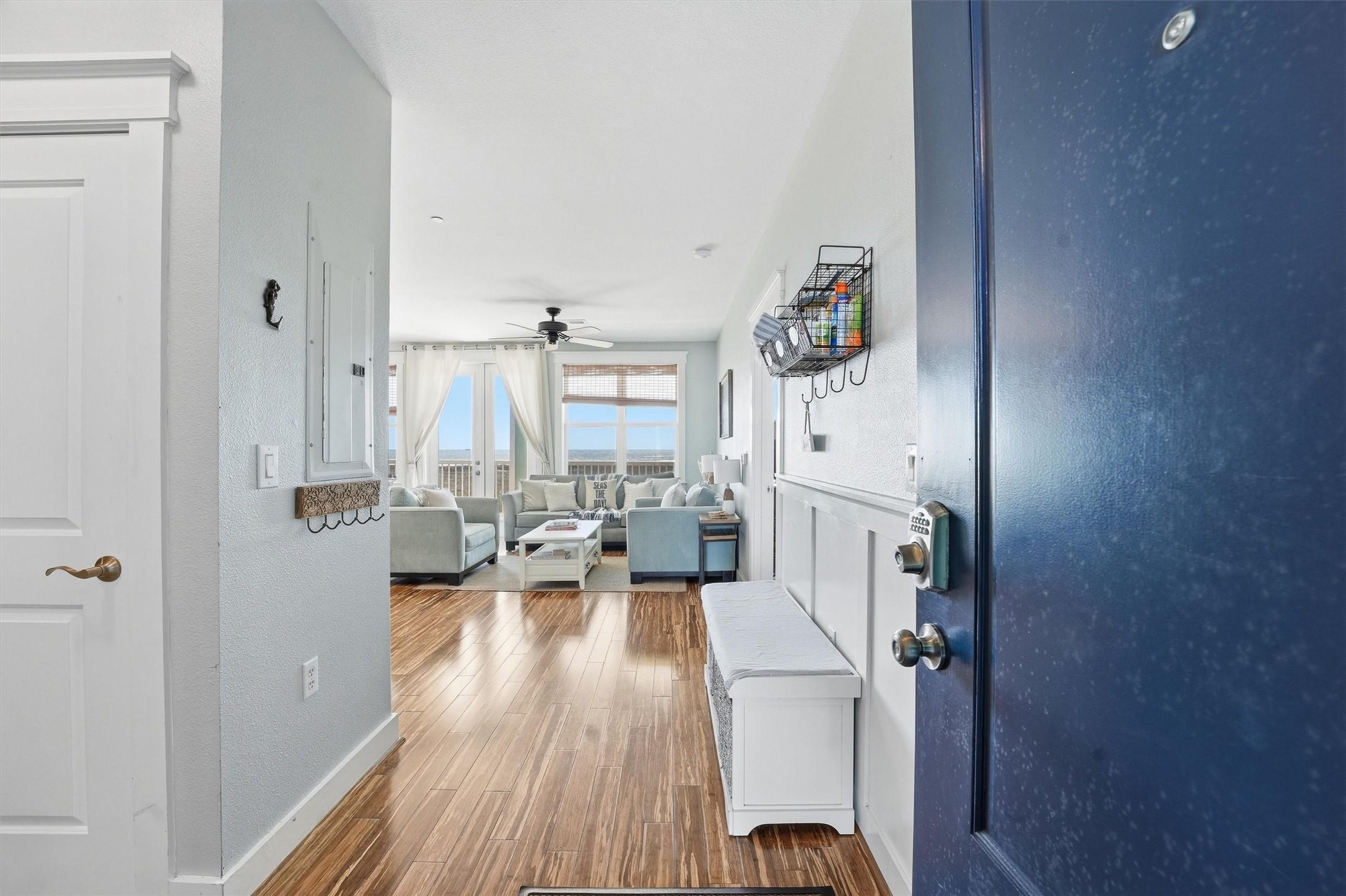 Image 2: A welcoming foyer opens the home with bamboo floor