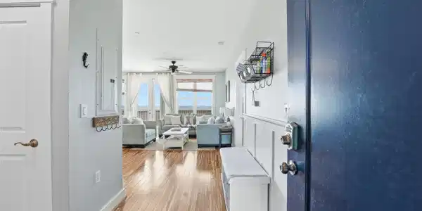 Image 2: A welcoming foyer opens the home with bamboo floor