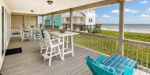 Image 3: Large covered front deck with lots of seating room