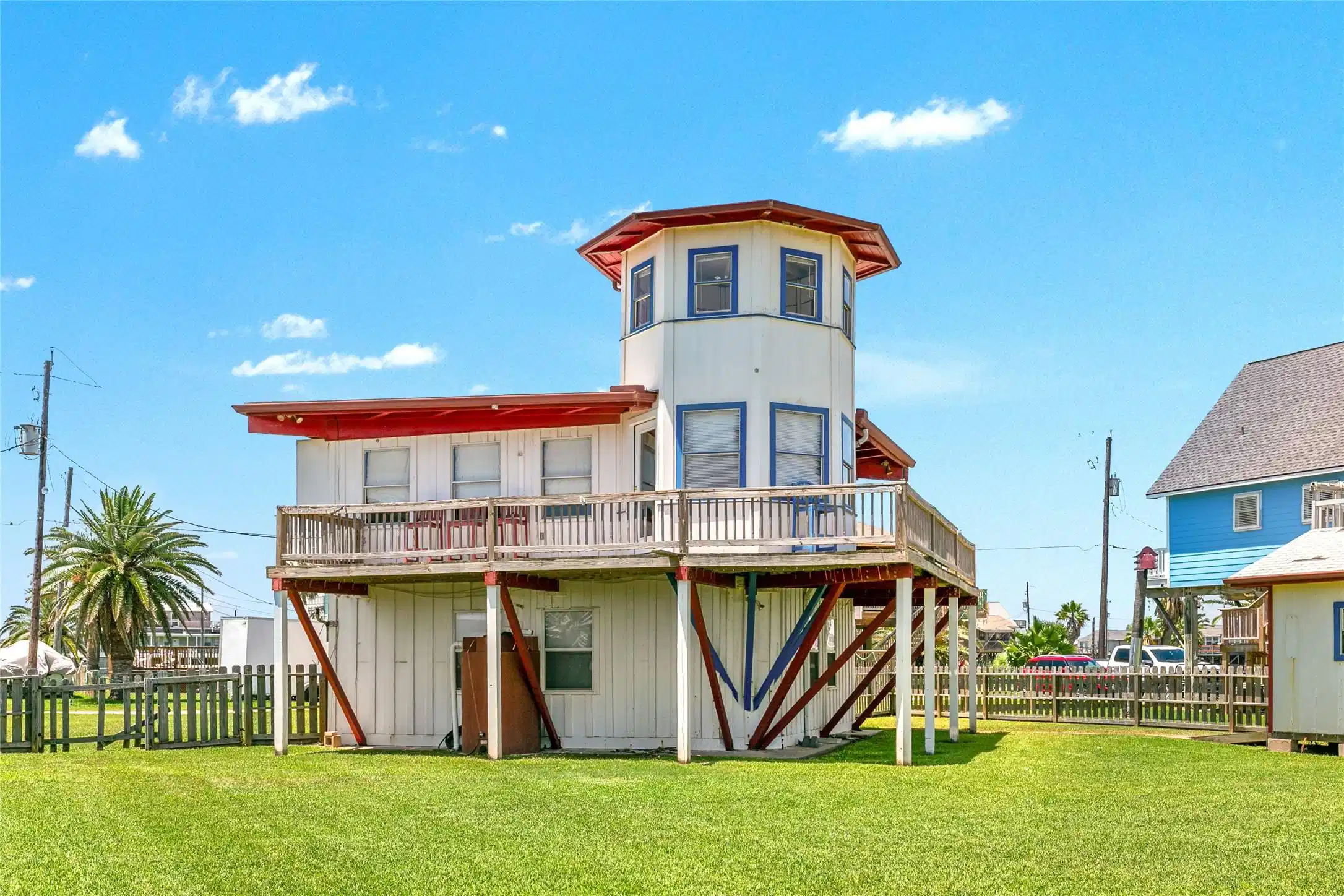 Image 1: A fun, lighthouse-inspired home with beautiful wat