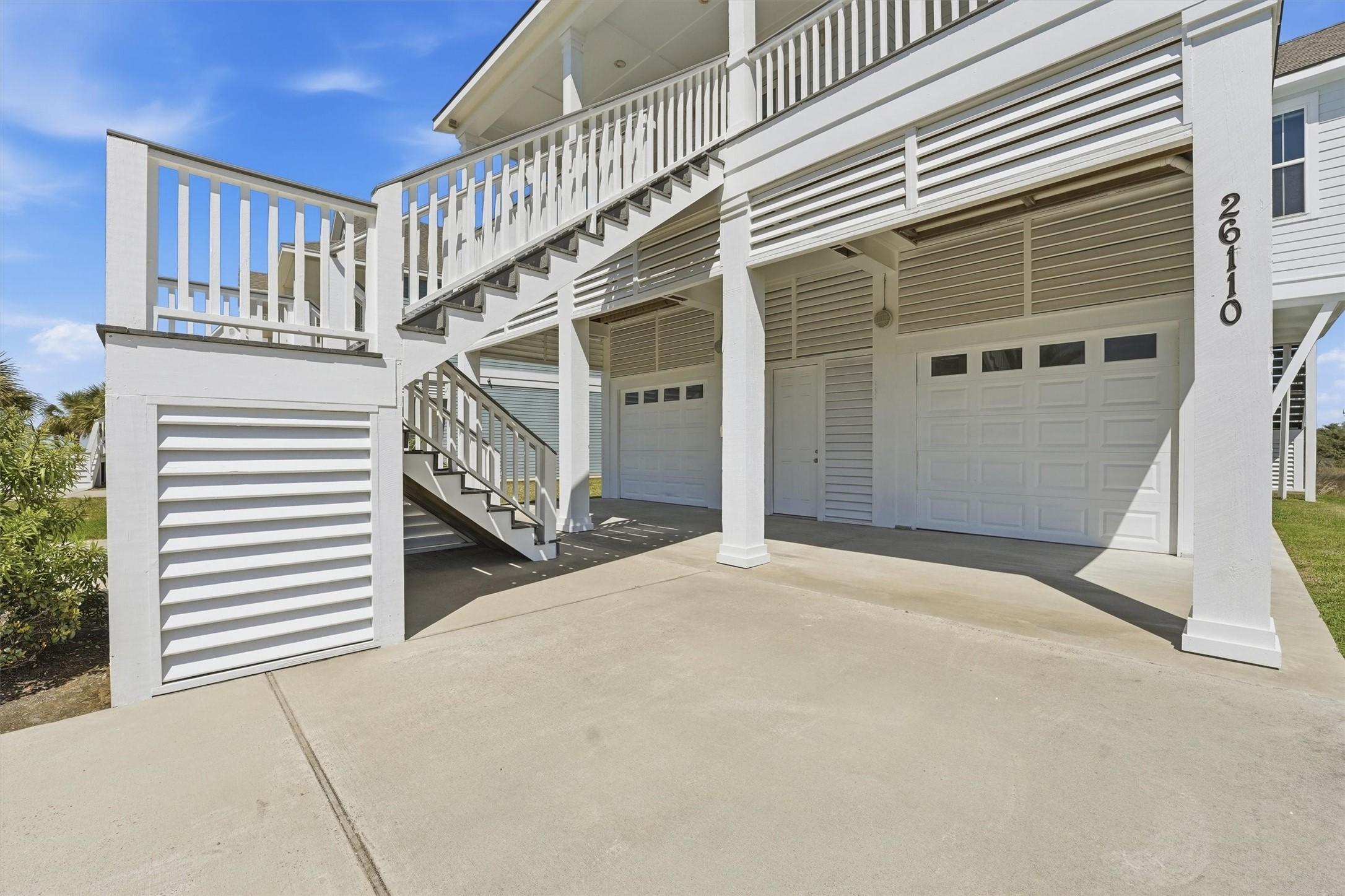 Image 3: Covered parking and a large garage area provide pl