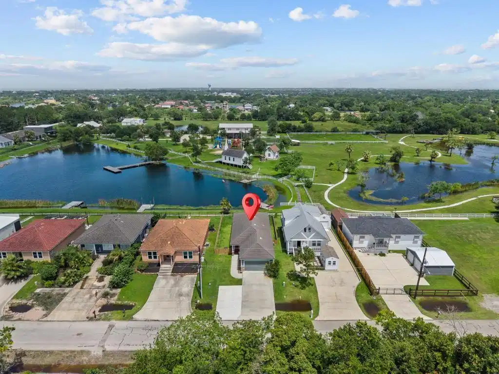 Image 1: Aerial shot of this charming home! Enjoy the views