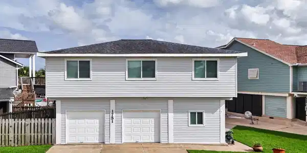 Image 2: Wide driveway and large corner lot